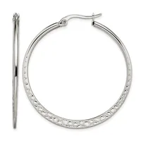 A pair of silver-toned hoop earrings with textured surfaces and hinged closures, shown from front and side views.