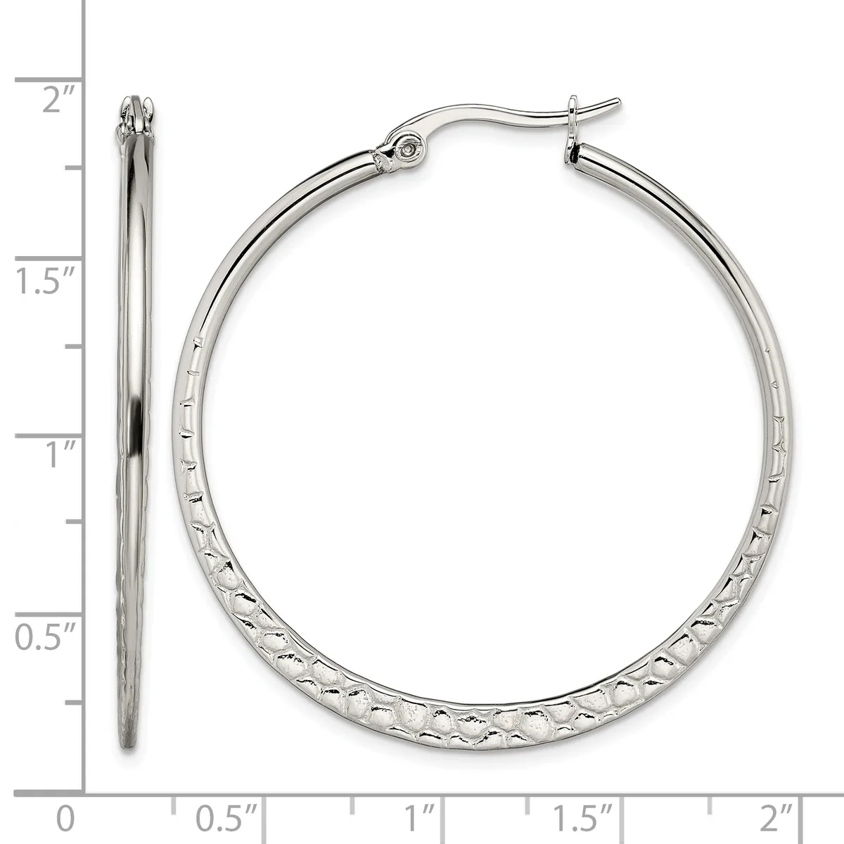 A pair of silver-toned hoop earrings with a textured diamond-cut surface, shown from front and side views next to a measurement ruler indicating they are approximately 1.5 inches in diameter.