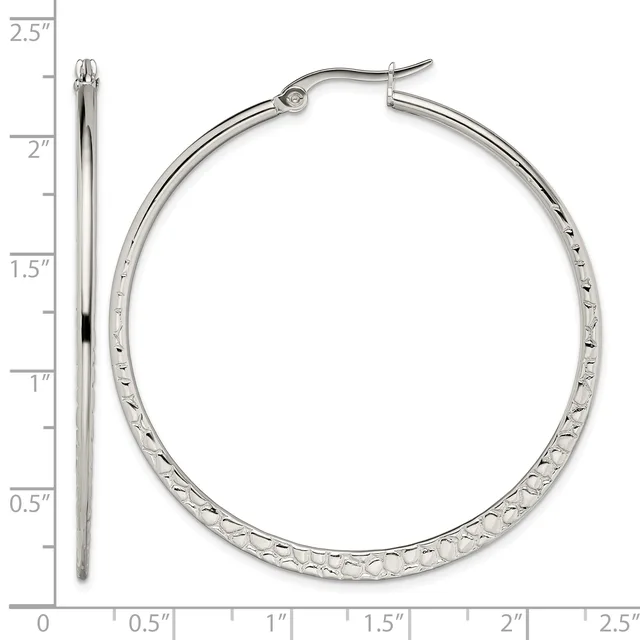 Silver-tone hoop earrings with textured surface, shown front and side view against a ruler measuring approximately 2.25 inches in diameter.