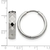 A pair of silver hoop earrings with faceted surfaces displayed next to a side view of a single textured hoop earring on a measurement scale.