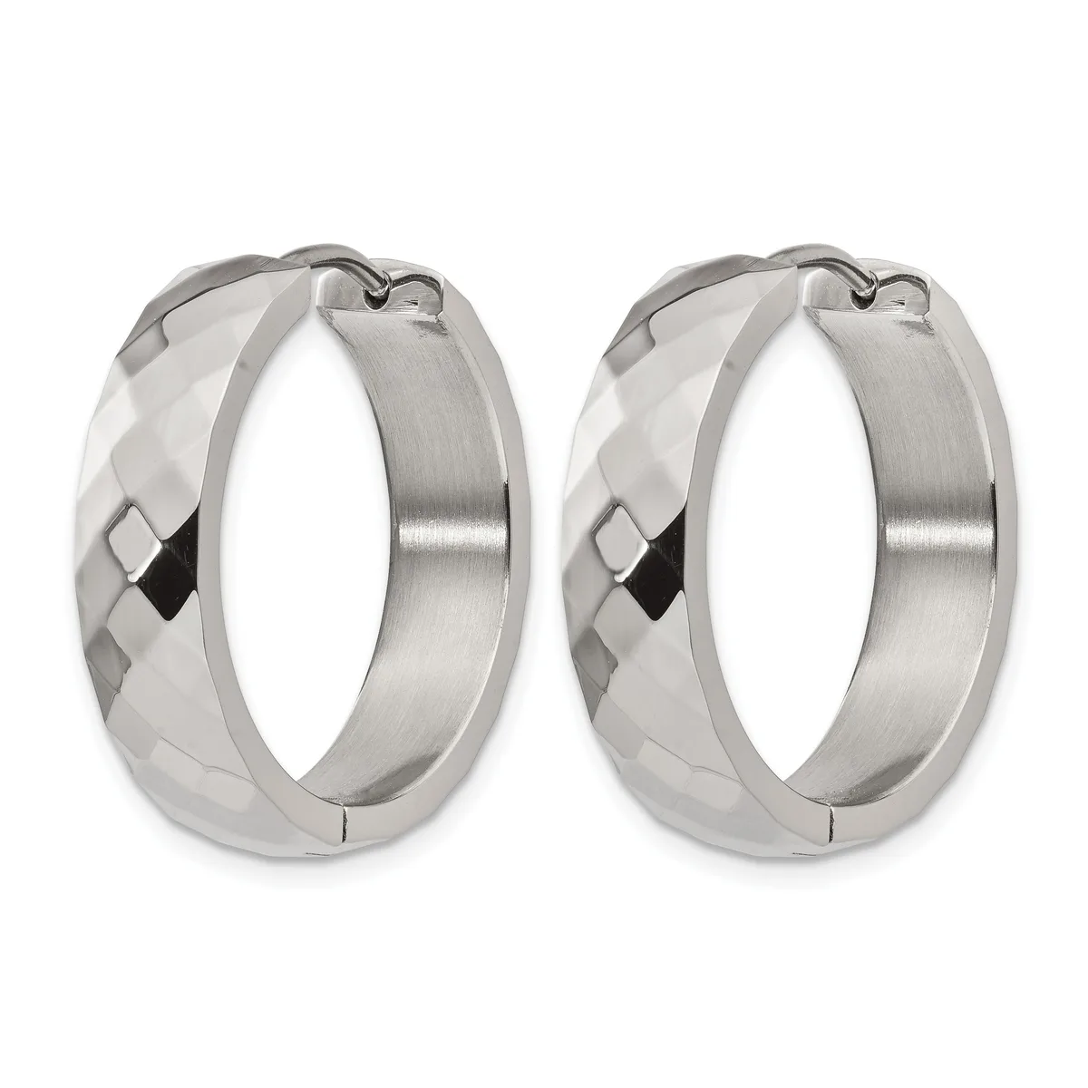A pair of polished silver hoop earrings with faceted texture on the outer surface and a hinged closure.