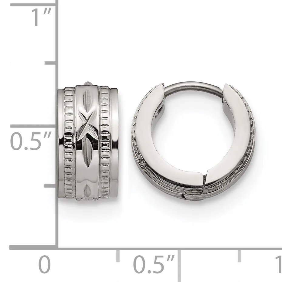Pair of polished silver-toned chunky hoop earrings with textured center band and linear detailing, shown next to a measurement scale.