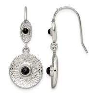 Silver dangle earrings with textured circular disc pendants featuring black onyx cabochon centers, shown from front and side views.