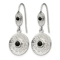 Pair of silver drop earrings with textured oval and circular disc elements, each centered with a black onyx stone, suspended from wire hooks.