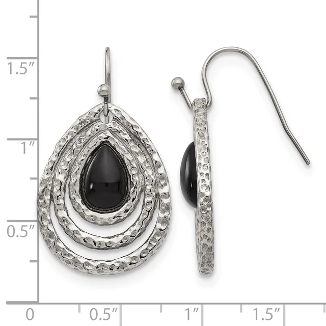 A pair of silver teardrop earrings with black onyx centers surrounded by textured oval frames, shown next to a measurement scale indicating approximately 1.5 inches in length.