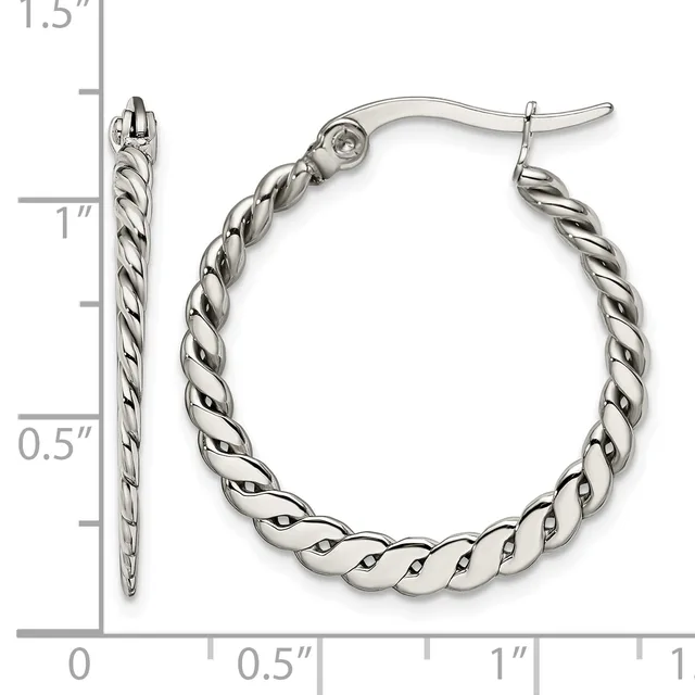 A pair of silver twisted hoop earrings with post and clutch backs, shown next to a ruler measuring approximately 1.25 inches in diameter.