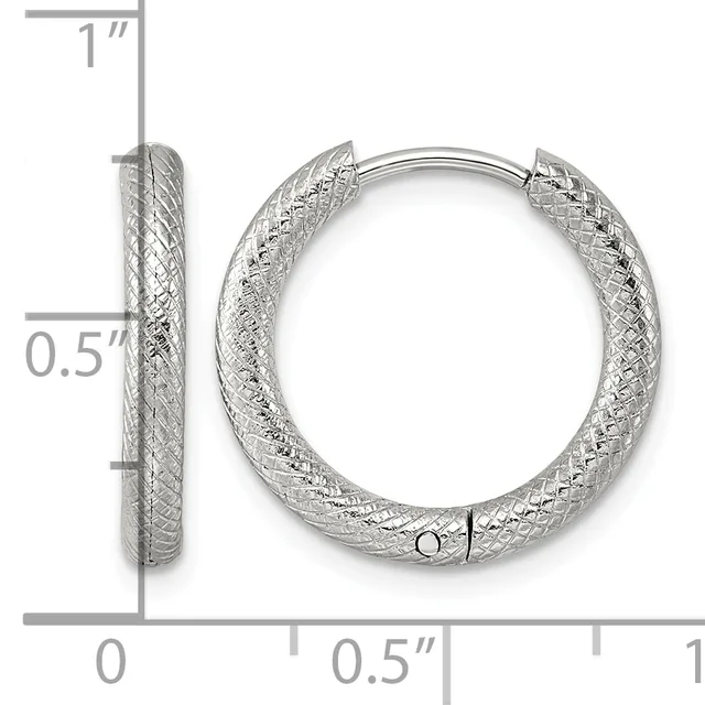 Silver textured hoop earrings shown from front and side view with measurement scale indicating approximately one inch in height and half inch in width.