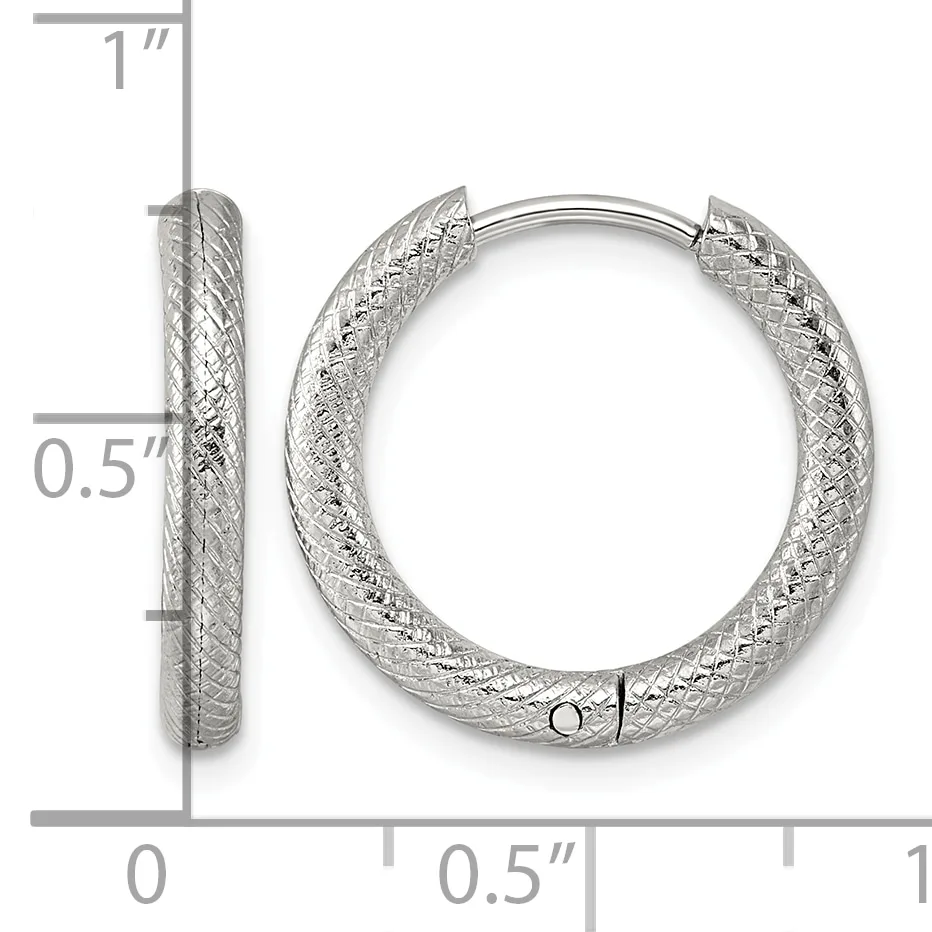 Silver textured hoop earrings shown from front and side view with measurement scale indicating approximately one inch in height and half inch in width.