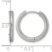 Silver textured hoop earrings shown from front and side view with measurement scale indicating approximately one inch in height and half inch in width.