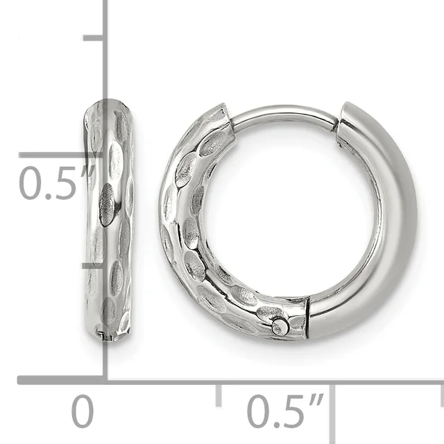 Pair of silver huggie hoop earrings with textured finish, shown against a ruler measuring approximately 0.5 inches in diameter.