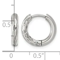 Pair of silver huggie hoop earrings with textured finish, shown against a ruler measuring approximately 0.5 inches in diameter.