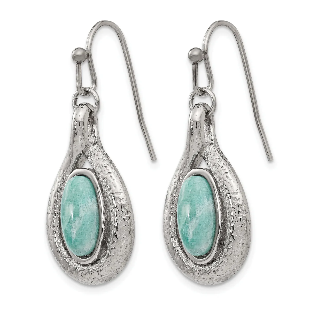 A pair of silver teardrop earrings with turquoise oval cabochon centers and textured metal surrounds, suspended from hook-style ear wires.
