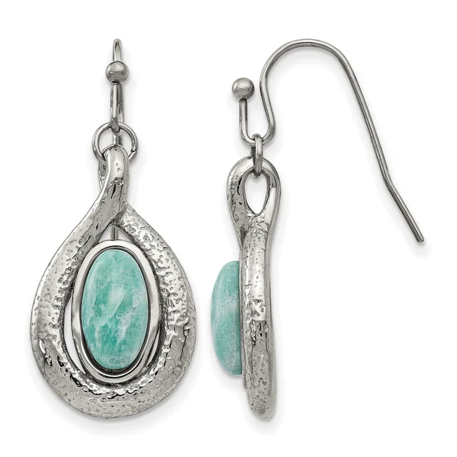 A pair of silver teardrop earrings with textured surfaces, each featuring an oval turquoise stone in the center, shown from front and back views with fish hook ear wires.