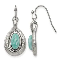 A pair of silver teardrop earrings with textured surfaces, each featuring an oval turquoise stone in the center, shown from front and back views with fish hook ear wires.