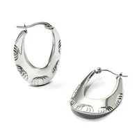 Two silver hoop earrings with textured oval shapes and decorative striped patterns on the sides, shown from front and back angles.