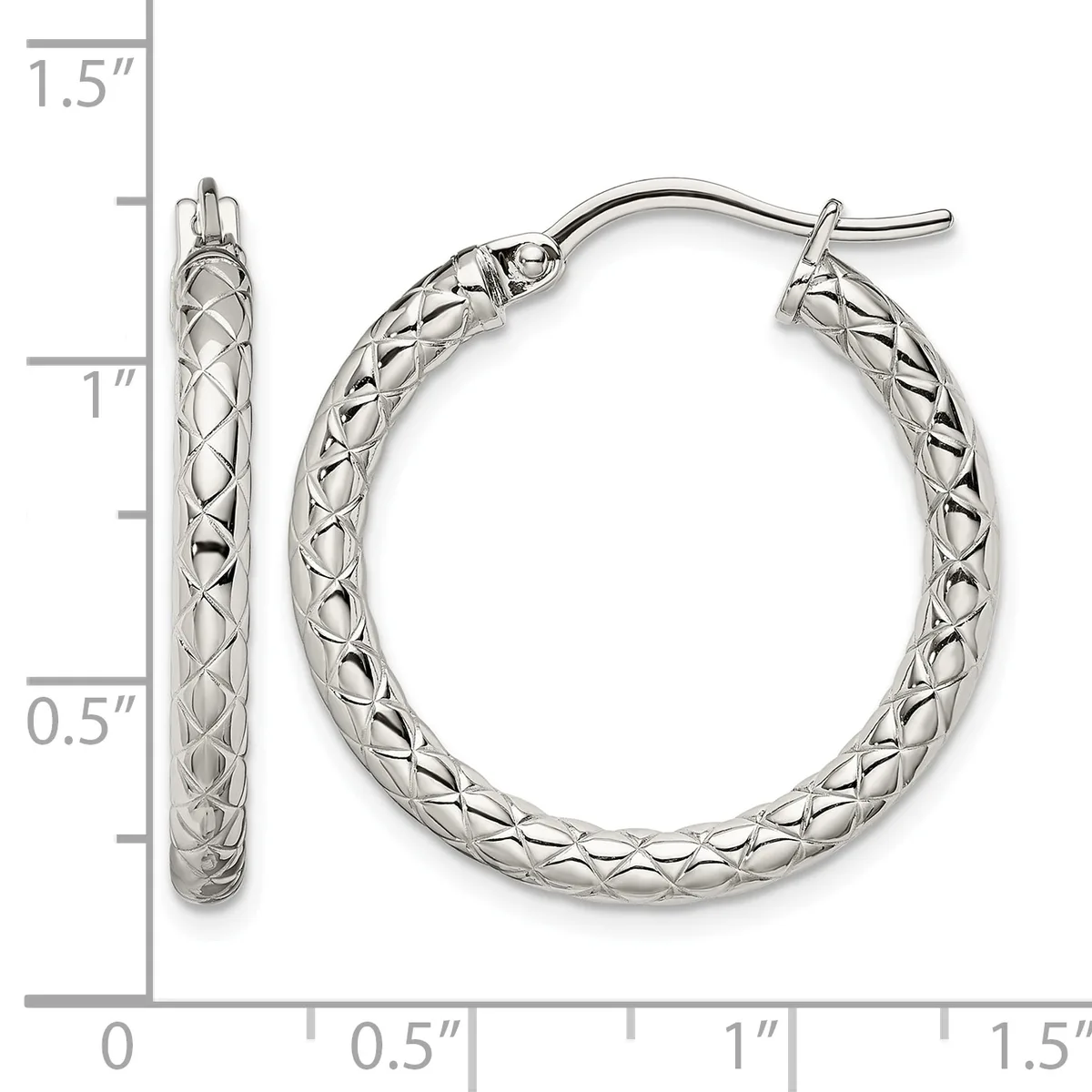 A pair of silver hoop earrings with a textured crosshatch pattern, measuring approximately 1.25 inches in diameter, displayed against a measurement scale.