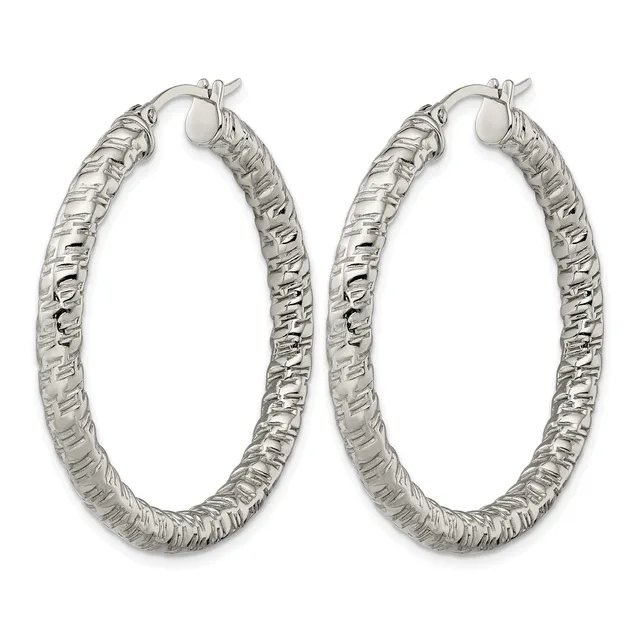 A pair of silver hoop earrings with a textured, hammered surface finish and hinged closure posts, displayed against a white background.
