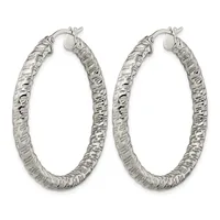 A pair of silver hoop earrings with a textured, hammered surface finish and hinged closure posts, displayed against a white background.