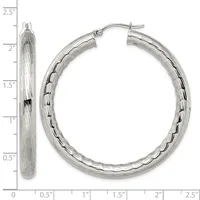 A pair of silver textured hoop earrings with hinged posts, displayed against a measurement scale showing they are approximately 2.25 inches long.