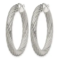 A pair of silver hoop earrings with a textured, woven surface finish and hook closures.