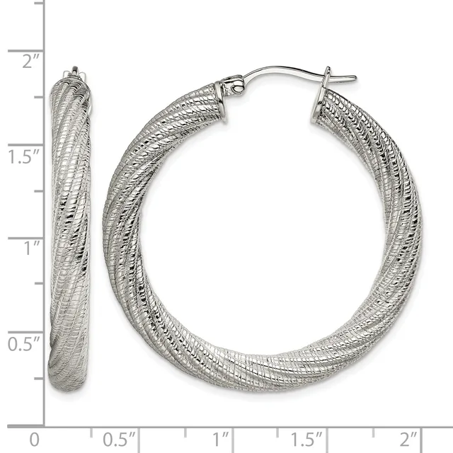 Pair of textured silver-tone hoop earrings with a dimpled surface finish, displayed open and closed against a measurement scale showing approximately 1.5 inches in diameter.