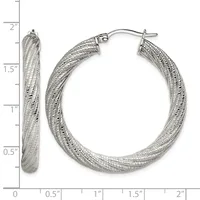 Pair of textured silver-tone hoop earrings with a dimpled surface finish, displayed open and closed against a measurement scale showing approximately 1.5 inches in diameter.