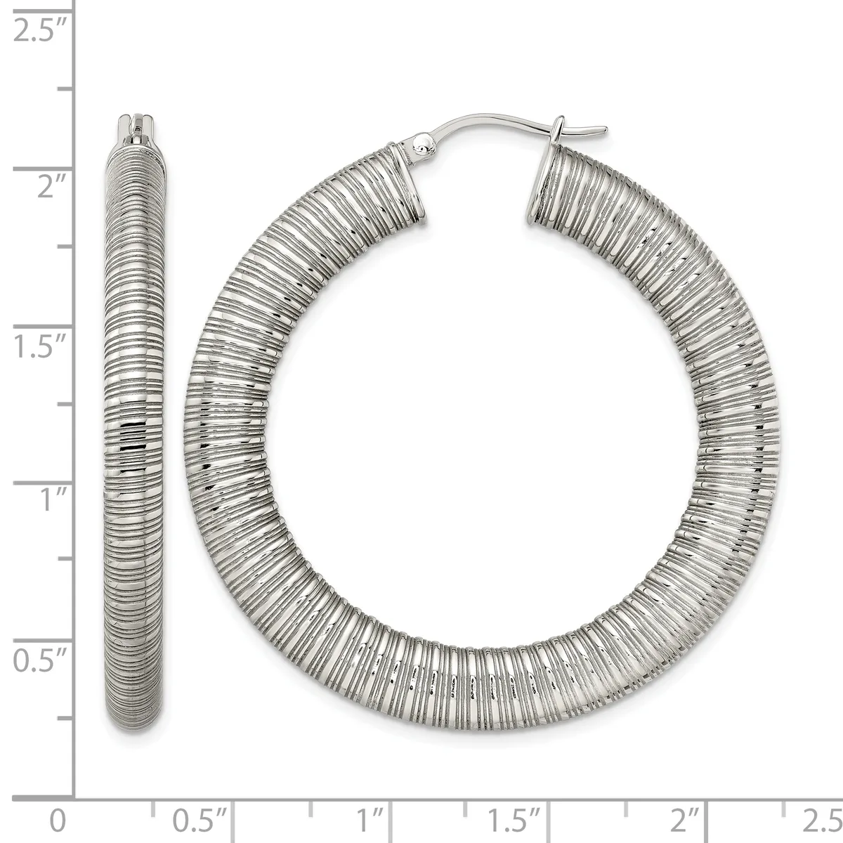Pair of textured silver-tone hoop earrings with ridged surface detail, shown at actual size on a measurement scale from 0 to 2.5 inches.