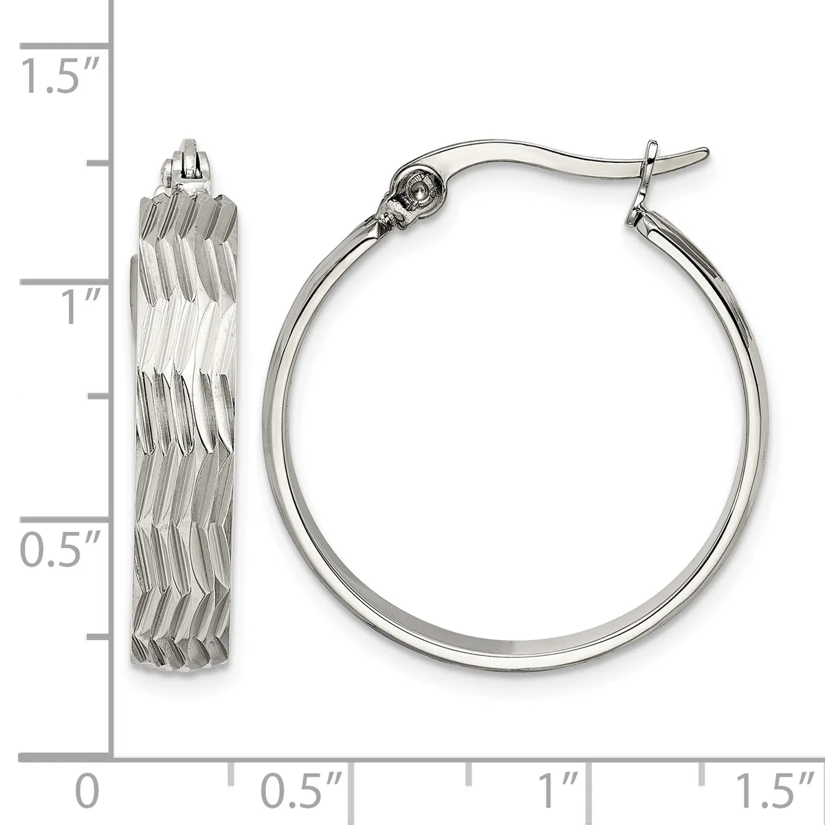 A pair of silver-toned hoop earrings with textured diagonal ridged surfaces, shown next to a measurement scale indicating approximately one inch in diameter.