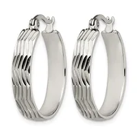 Pair of silver-toned hoop earrings with ridged texture on the outer surface and smooth polished finish on the inner curved edge, shown from the front.
