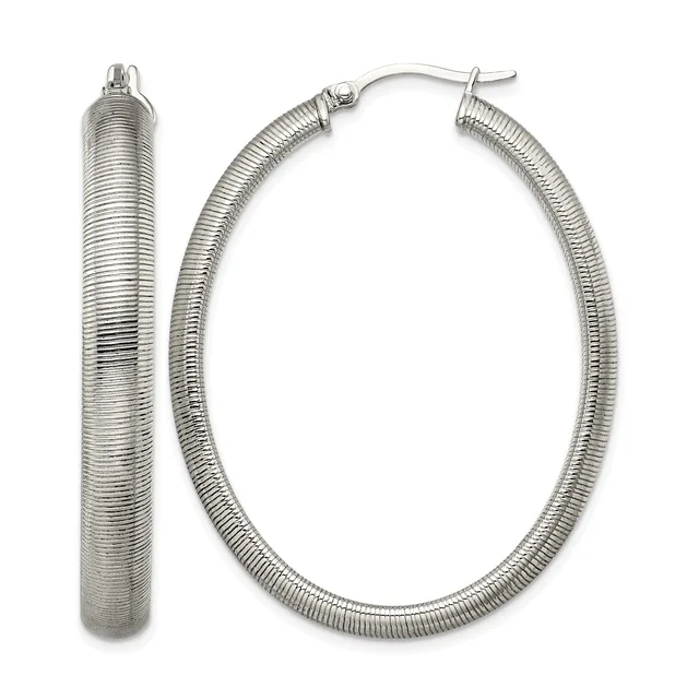 A pair of silver textured hoop earrings with a ribbed surface finish and hook closures, shown from front and side views.