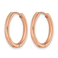 A pair of rose gold hoop earrings with textured surfaces and hinged closures, displayed side by side against a white background.