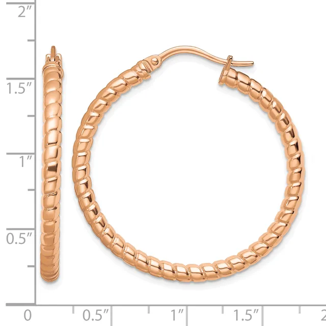 Rose gold hoop earrings with a textured rope pattern, displayed with measurement scale showing approximately 1.5 inches in diameter.