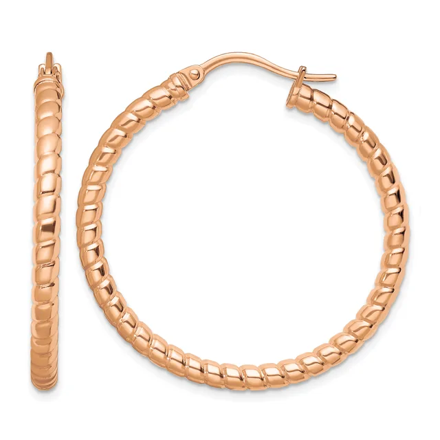 A pair of rose gold hoop earrings with a textured quilted surface pattern, shown from the front and side view.