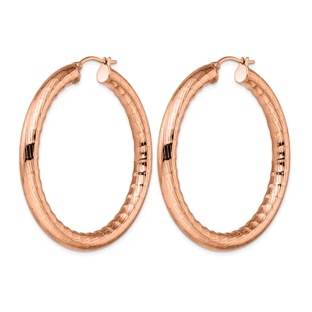A pair of rose gold hoop earrings with a textured surface and small posts with backs, displayed against a white background.