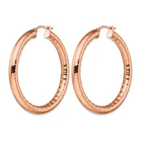 A pair of rose gold hoop earrings with a textured surface and small posts with backs, displayed against a white background.
