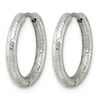 A pair of silver hoop earrings with a textured, hammered surface finish and a small hallmark, shown against a white background.