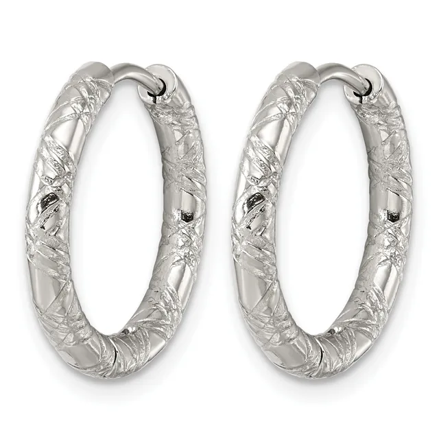 A pair of silver hoop earrings with a textured, hammered surface finish and hinged closures, displayed side by side.