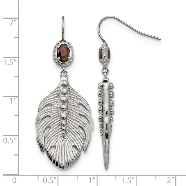 Pair of silver feather-shaped dangle earrings with brown oval stones at the top, shown front and side view against a measurement scale.