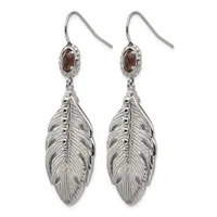 Pair of silver feather drop earrings with garnet cabochon studs and French wire hooks.