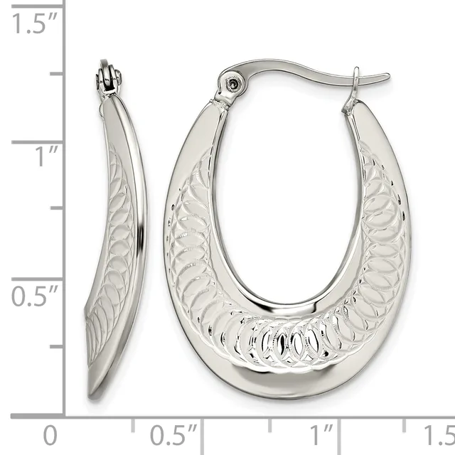 A pair of silver hoop earrings with a textured leaf or feather pattern on the outer surface, shown with a measurement scale indicating approximately one inch in height.