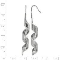 A pair of silver twisted ribbon dangle earrings with hook closures, shown against a ruler measuring approximately 2.5 inches in length.