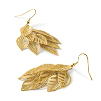 A pair of gold-toned leaf-shaped dangle earrings with detailed vein texturing, shown from two angles with fish hook closures.