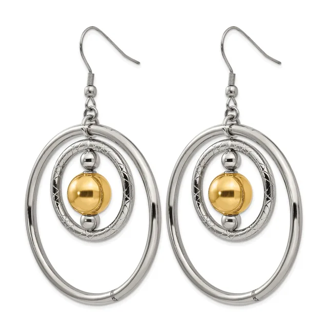 A pair of silver-toned dangle earrings with concentric oval rings and a gold-colored spherical bead suspended in the center.
