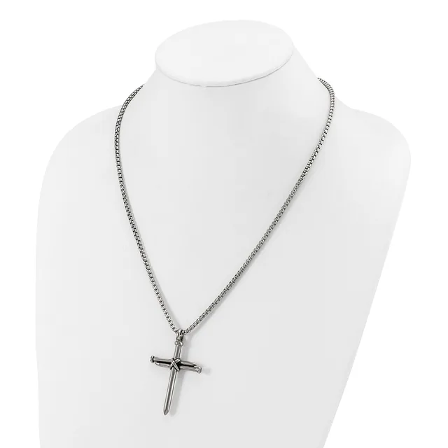 Silver-toned chain necklace with a cross pendant displayed on a white mannequin bust.