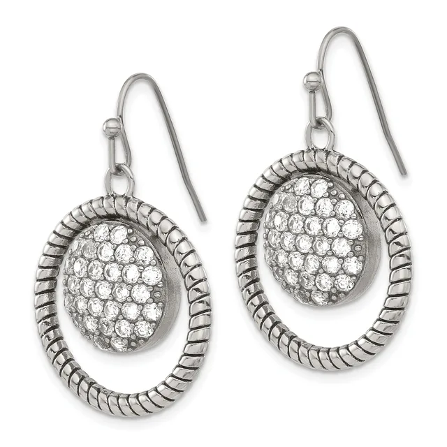Pair of silver teardrop earrings with textured oval frames enclosing oval pavé crystal centers, suspended from hook wires.