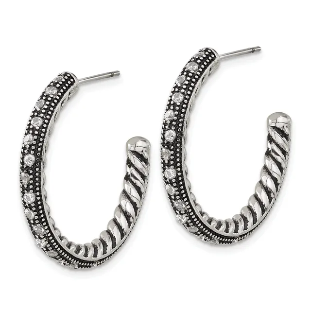Pair of silver hoop earrings with twisted inner texture and crystal-studded outer surface, shown from the front.