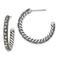 Pair of silver hoop earrings with twisted rope texture inner band and beaded outer edge, shown from front and side views.