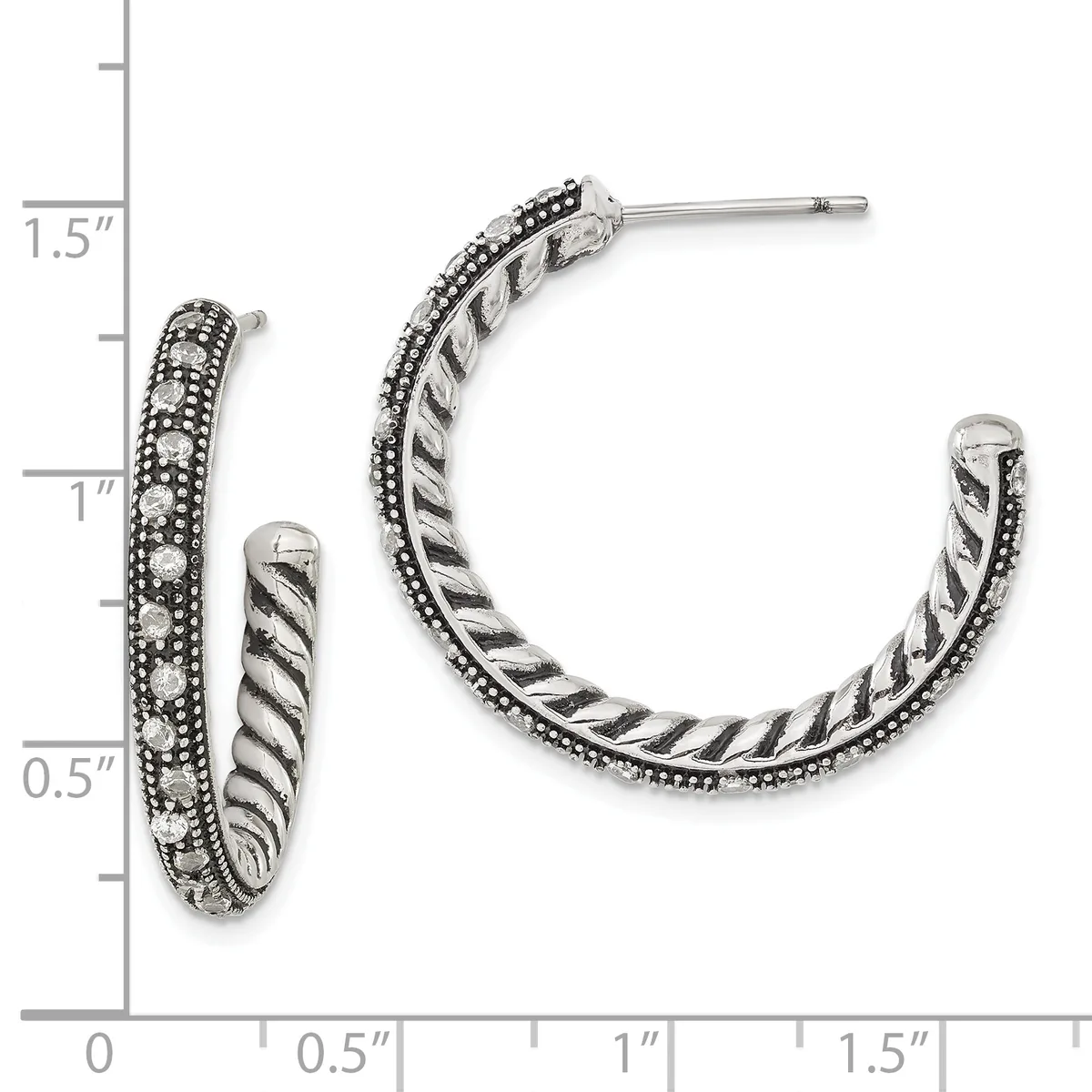 A pair of silver hoop earrings with twisted rope texture and beaded edges, displayed next to a measurement scale showing approximately one inch in diameter.