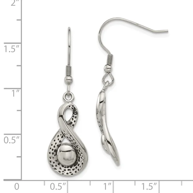 A pair of silver dangle earrings with textured teardrop pendants suspended from fish hook wires, displayed against a measurement ruler showing approximately 1.5 inches in length.