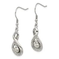 A pair of silver teardrop earrings with textured dot pattern detailing and smooth polished centers, suspended from silver fish hook wires.